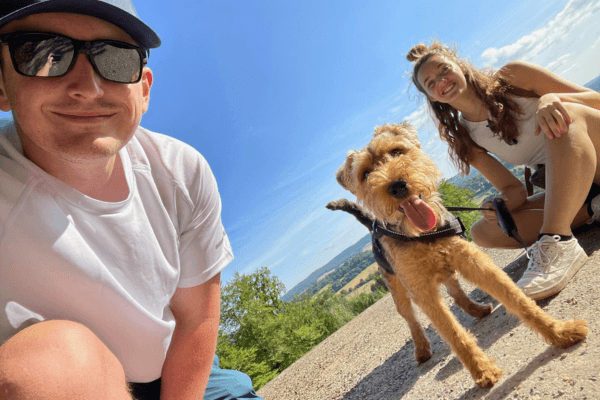 Sonny the Welsh Terrier with two humans