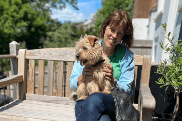 Red the Norfolk Terrier, with his borrower Frances