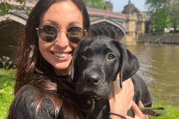 Wren the Labrador retriever with a young woman